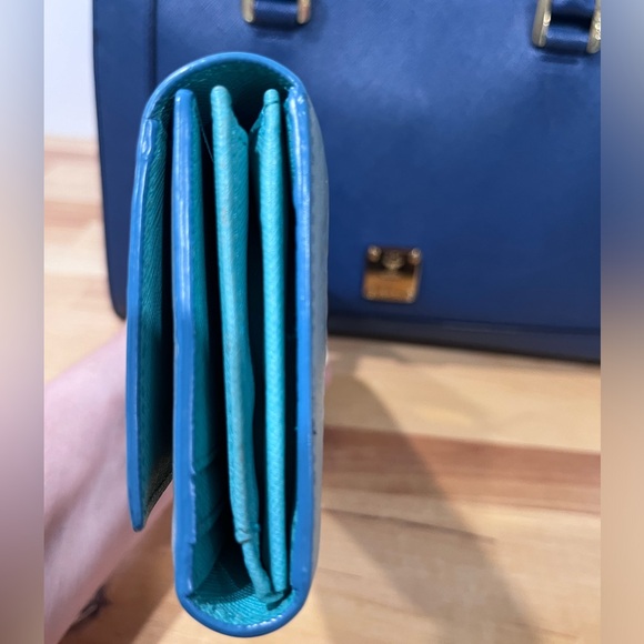 MCM Munchen trifold wallet in new condition except scratches on name plate. - Picture 12 of 15